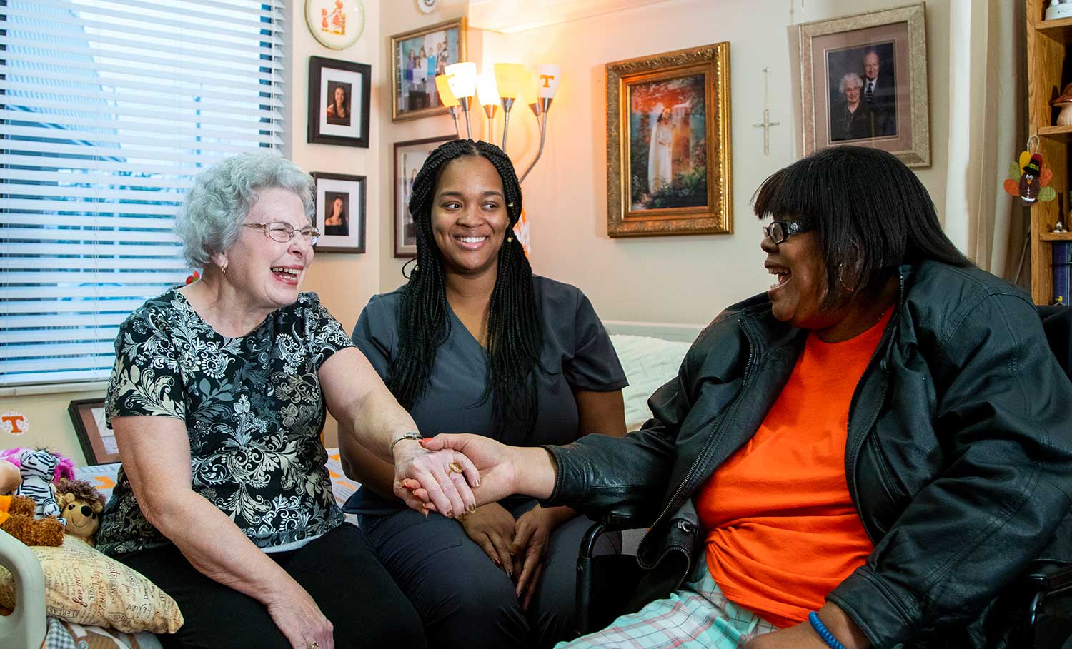 Residents in room with caregiver